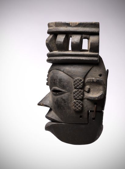 null Ogoni (Nigeria) Elegant mask of a young girl wearing an openwork hairstyle....
