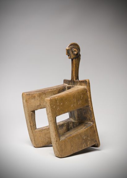 null Bobo (Burkina Faso) Seat representing a stylized kneeling figure. The slightly...