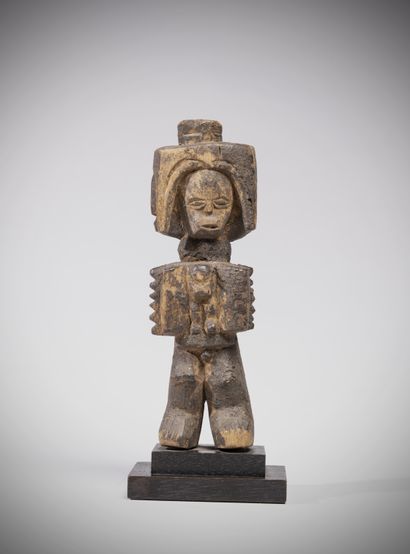 null Ijo (Nigeria) Representation of a bush spirit with four heads. The headdress...