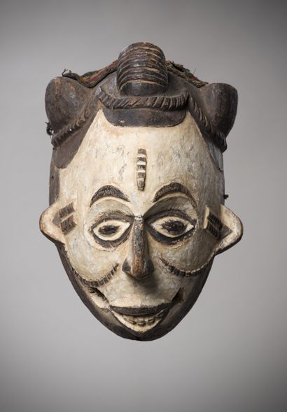 Idoma (Nigeria) This white mask coated with...