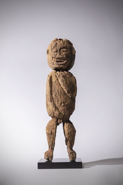 null Bamileke (Cameroon) Male commemorative statue in eroded wood with red ochre...