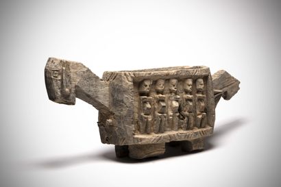 null Dogon (Mali) This receptacle in the shape of a horse, whose sides are carved...