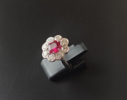 RING in white gold 750°/00 set with a ruby...