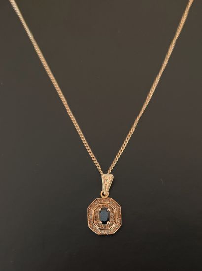 null CHAIN and pendant set with a small sapphire and white stone in yellow gold 750°/00

Gross...