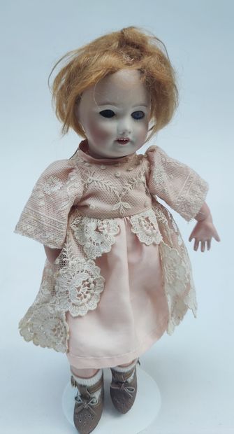  LITTLE DOLL marked UNIS, the head in cookie marked mold 301 open mouth, articulated...