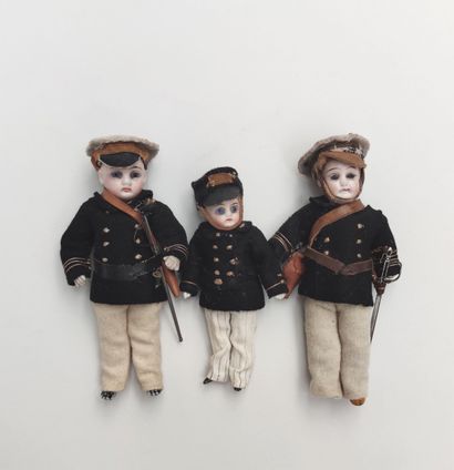  Set of three miniature soldiers, with composition or bisque bodies, heads in cast...