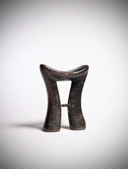 null Karamojong

(Uganda) Heavy wood neck rest, deep patina of use.

A twist of wire...