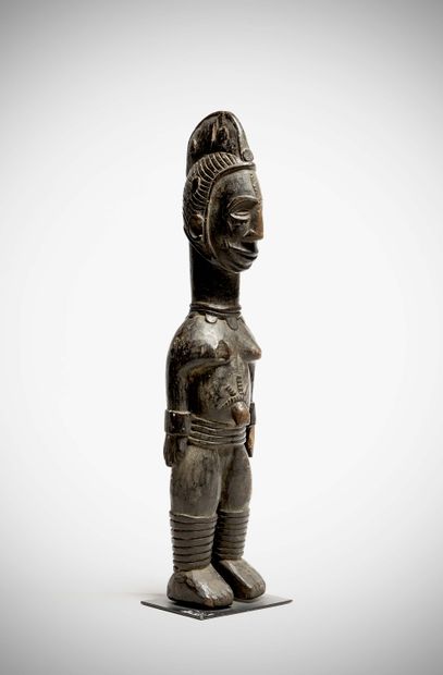 null Ibo

( Nigeria ) Large wooden doll with black lacquered patina, representing...