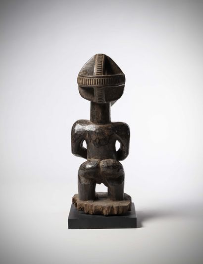 null Hemba 

(DRC) Very old female representation with an enlarged head wearing a...