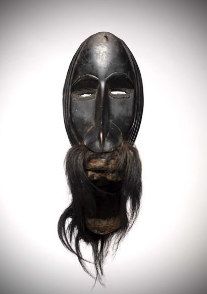 null Dan/Diomande

(Ivory Coast) Anthropo-zoomorphic mask with mobile jaw.

The lower...