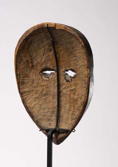 null Dan

(Ivory Coast) Dance mask with slit eyes and protruding forehead.

The right...