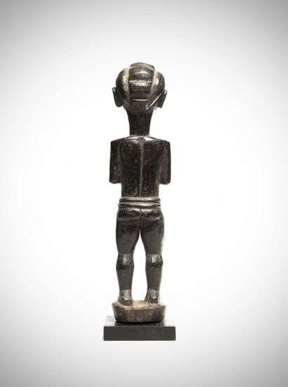 null Tiv

(Nigéria) Statue féminine en bois lourd à patine noire brillante.

Ces...