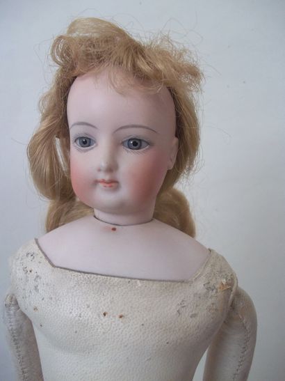 PARISIAN DOLL with swivel head on a pressed...