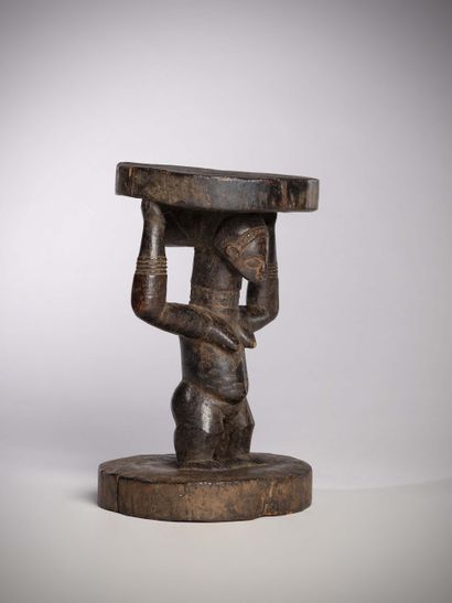 null Luba Congo (DRC) 
Small offering seat supported by a woman with her arms raised....