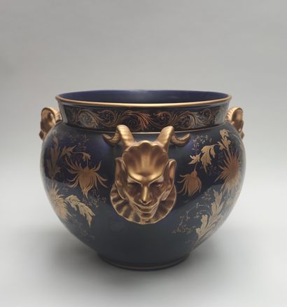 null POT HOLDER in blue glazed ceramic (repair to the nose of one of the fauns)