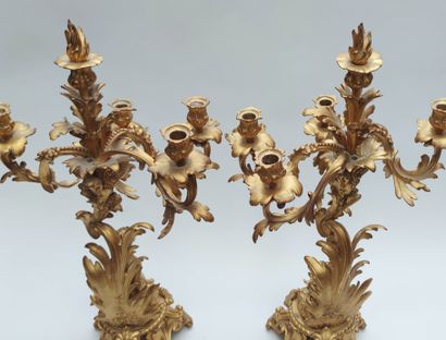 null Important pair of candelabras in chased and gilded bronze with five lights and...