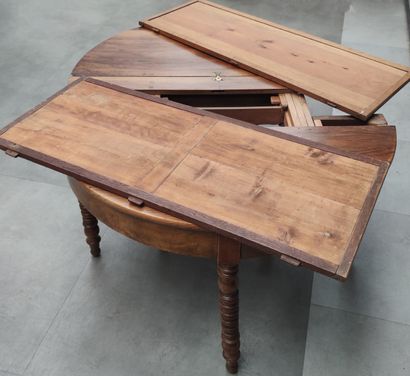 null TABLE of half-moon shape in walnut and walnut veneer, resting on seven legs,...