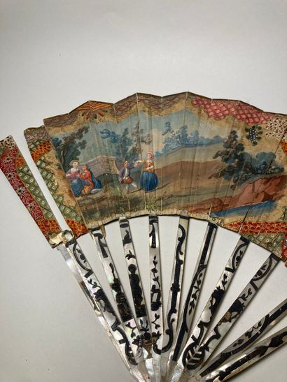 null Fan 
The mother-of-pearl and paper strands decorated with a patoral scene
18th...