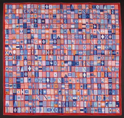 HERMES Carré 90x90 en soie, fond rouge dessins dégradé de bleus, roses "Voyage en...