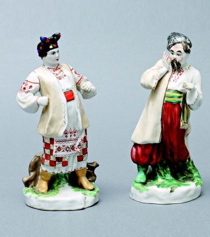 null Lot. 2 statuettes de porcelaine: Paysanne ukrainienne disputant un cosaque....