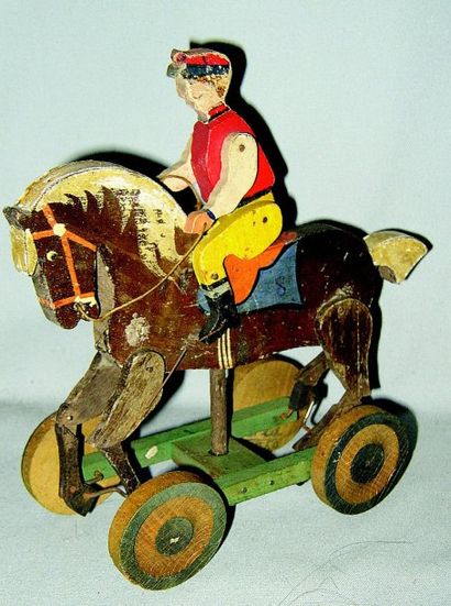 null « Cavalier » joli jouet articulé en bois sur roulettes, jambes du cheval animées....