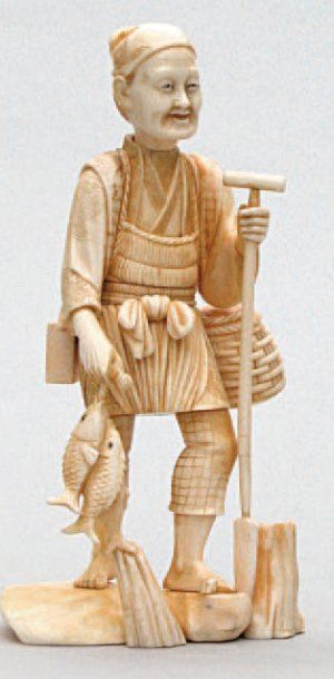 OKIMONO en ivoire représentant un pêcheur...