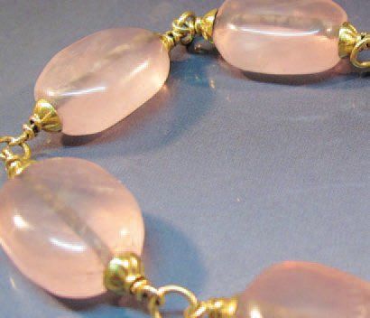 null BRACELET en or jaune et quartz rose. Poids : 26.50 g. Longueur : 20 cm