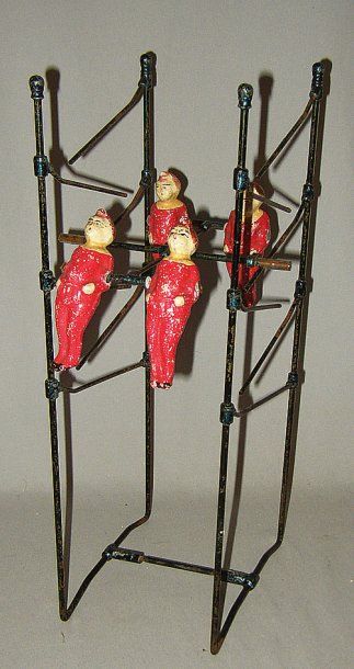 null « Les Voltigeurs », jouet en métal breveté en 1908 par PEAN Frères. Quatre personnages...