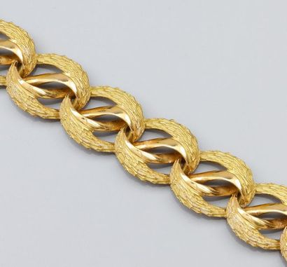 null Bracelet en or jaune 750°/00, à maillons ovales articulés façon passementerie...