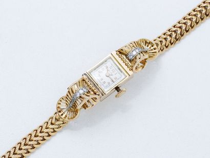 null Montre bracelet de dame en or 750 millièmes, cadran ivoire avec chiffres arabes...