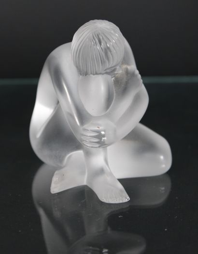 null LALIQUE
Moulded pressed crystal lot comprising three crouching nudes, one of...