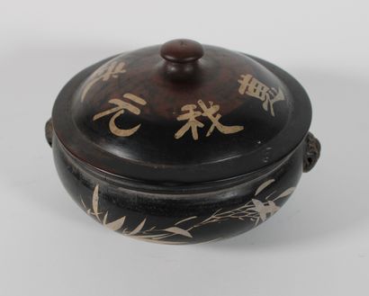 null Painted ceramic covered box adorned with painted Chinese characters and surrounded...