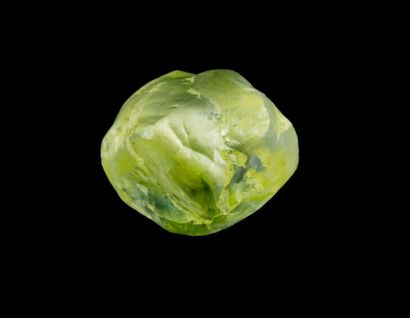  Rough fancy greenish yellow diamond of 1.26 ct. with trigons on the surface. Some...