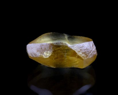  A rough diamond of 1.03 ct. of intense yellow colour tending to green (fancy greenish...