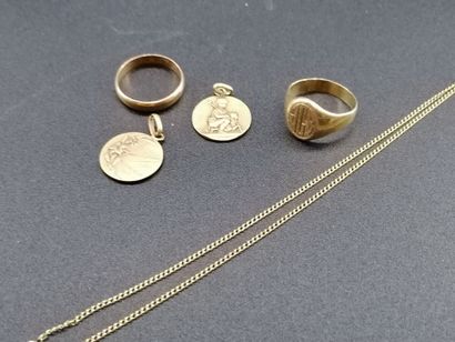 null Set including a yellow gold medal and chain, yellow gold signet ring, yellow...