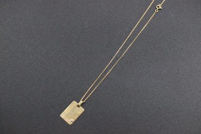 null Chain and pendant in yellow gold with a small diamond. 4 grs 