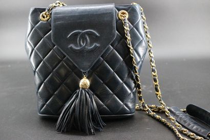 null CHANEL- Blue quilted leather bag with pompom clasp, gold metal chain and leather....