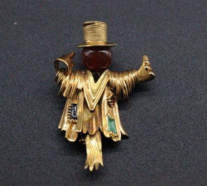 null Brooch scarecrow in yellow gold decorated with diamonds and green and blue enamel....