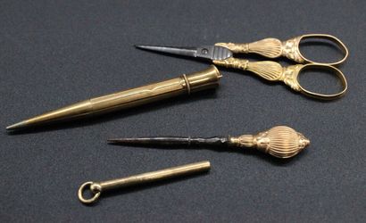 Pencil, scissors and various in yellow gold....