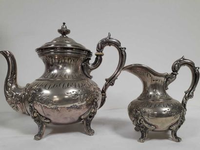 null Teapot and milk jug in silver plated metal in the Louis XV style, standing on...