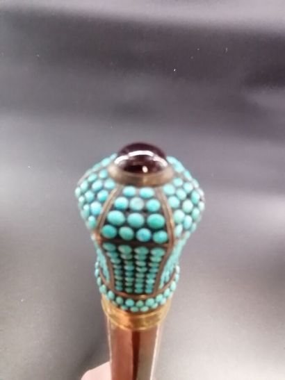 null Cane in natural wood decorated with a silver pommel with 18 k gold ring decorated...