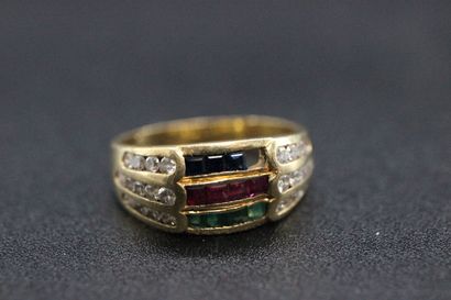 null Yellow gold ring set with 3 lines of red, blue and green stones, surrounded...