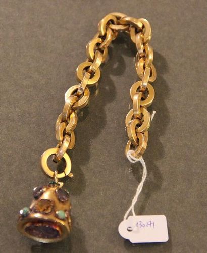 null Bracelet en or jaune orné d'un pendentif en cloche agrémenté de pierres jaunes,...