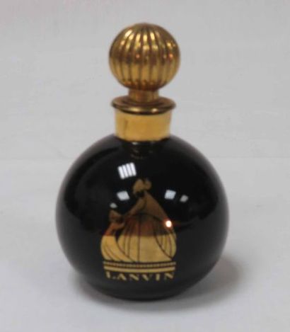 null JEANNE LANVIN
Flacon boule noire, modèle Art Déco, décoré sur fond or de Madame
Jeanne...