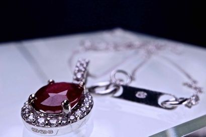 null Necklace in 18 kt rhodium plated white gold and natural red blood ruby of oval...