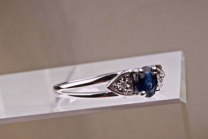 null Designer ring in 18Kt white gold with 0.45 carat certified central sapphire...