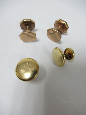 null Set of two pairs of gold and gold-plated metal cufflinks.