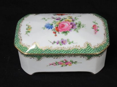 null White porcelain box with polychrome decoration of flowers and gold highlights....