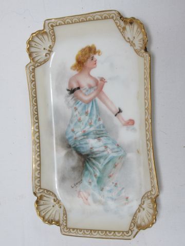 null Lovely polychrome porcelain pouch holder featuring a young woman. Signed Devoux....