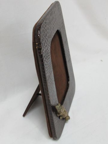 null Wooden photo frame with crocodile style leather, decorated with a bronze crocodile....